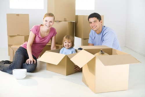 Removal crew handling household items with care during a move