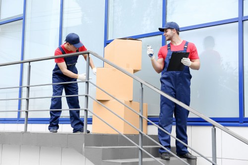Careful handling of boxes during a Kennington removals job