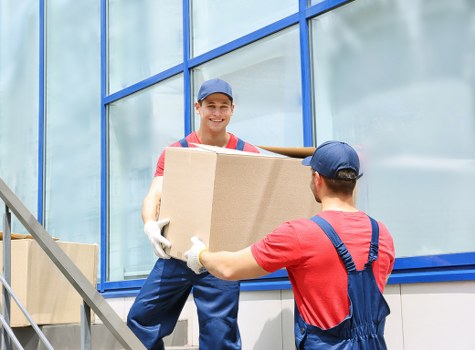 Office movers handling desks and IT equipment during a Kennington relocation