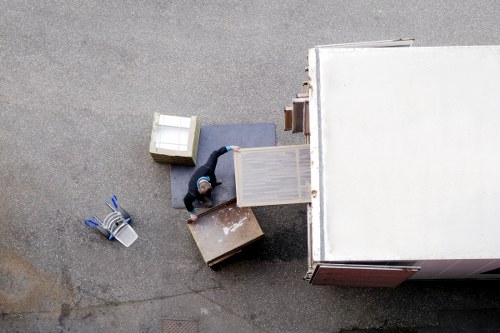 Local office relocation team moving furniture in a Kennington business area
