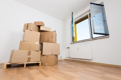 Packed boxes and furniture ready for removal van transport