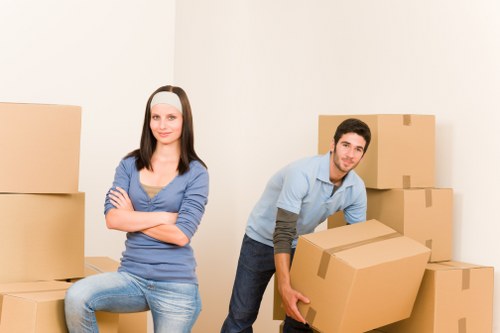 Local removals team loading household items for transport in Kennington