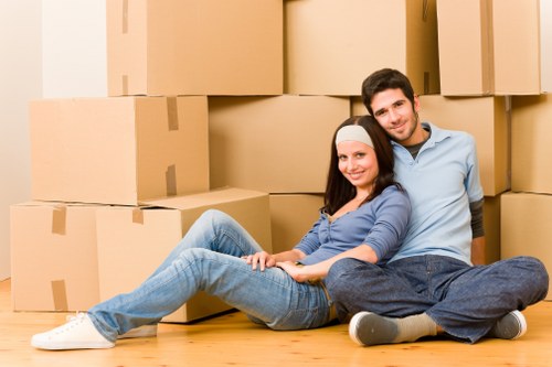 Packed household boxes and moving equipment ready for a Kennington move