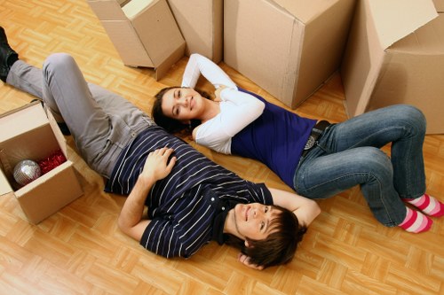 Professional moving team loading boxes and furniture
